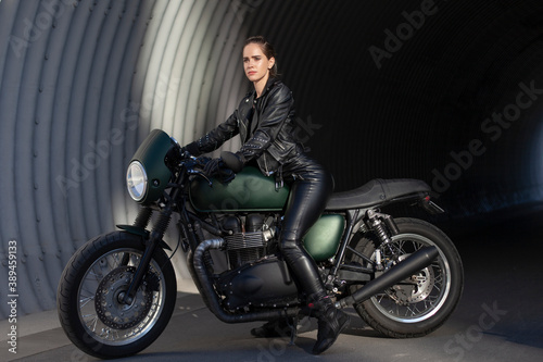 woman in black with a motorcycle