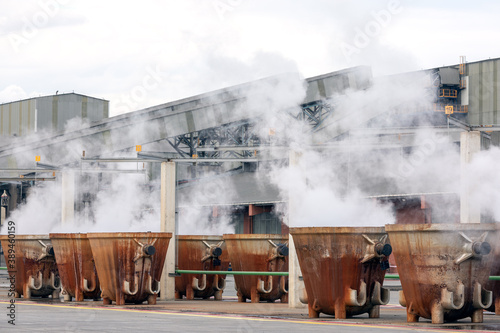 Hot slags in the melting pots in the copper processing factory. Copper slag is a by-product of copper extraction by smelting. During smelting, impurities become slag which floats on the molten metal. photo