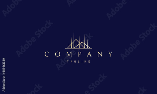Vector golden logo on which an abstract image of mountains with vertical rays.