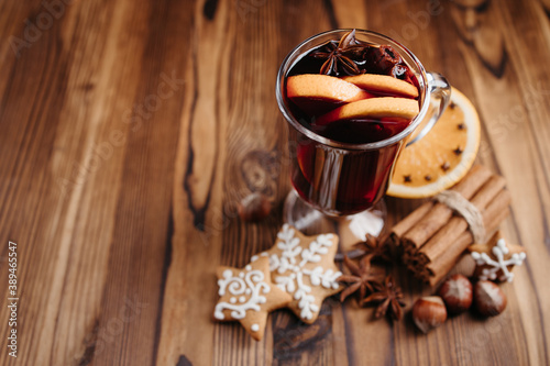 Holiday background with hot mulled wine and sweets
