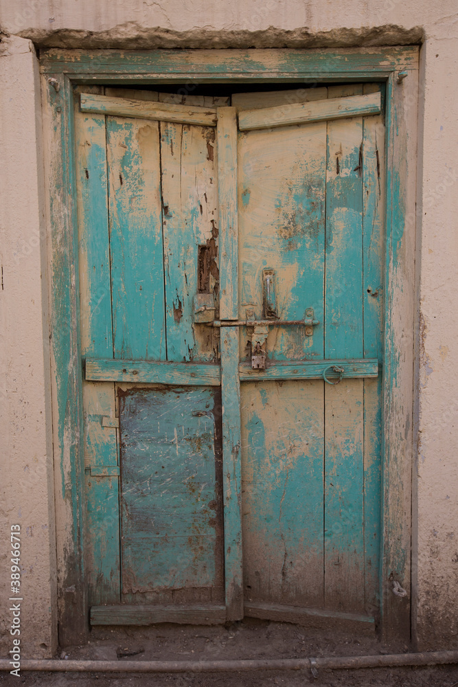 Old wooden door With blue cracked paint