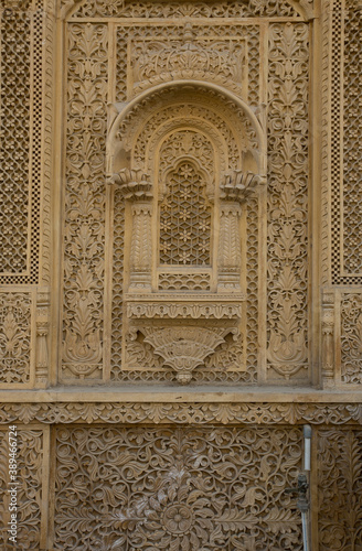 Carved ornament on the walls in Jaisalmer  Sand rock texture  background