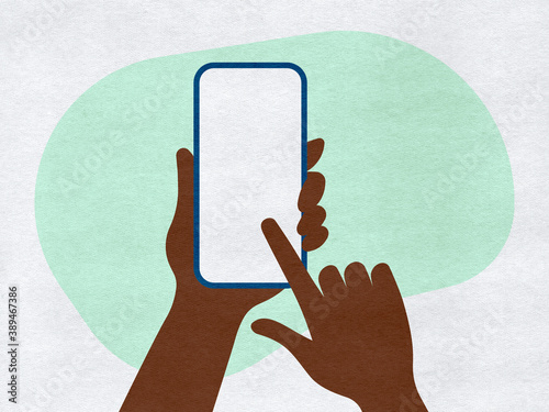 Hands holding a phone and finger touch screen on a colourful paper background