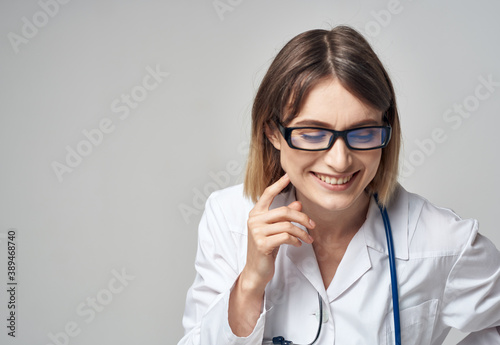 Doctor in a medical gown stethoscope glasses smile model