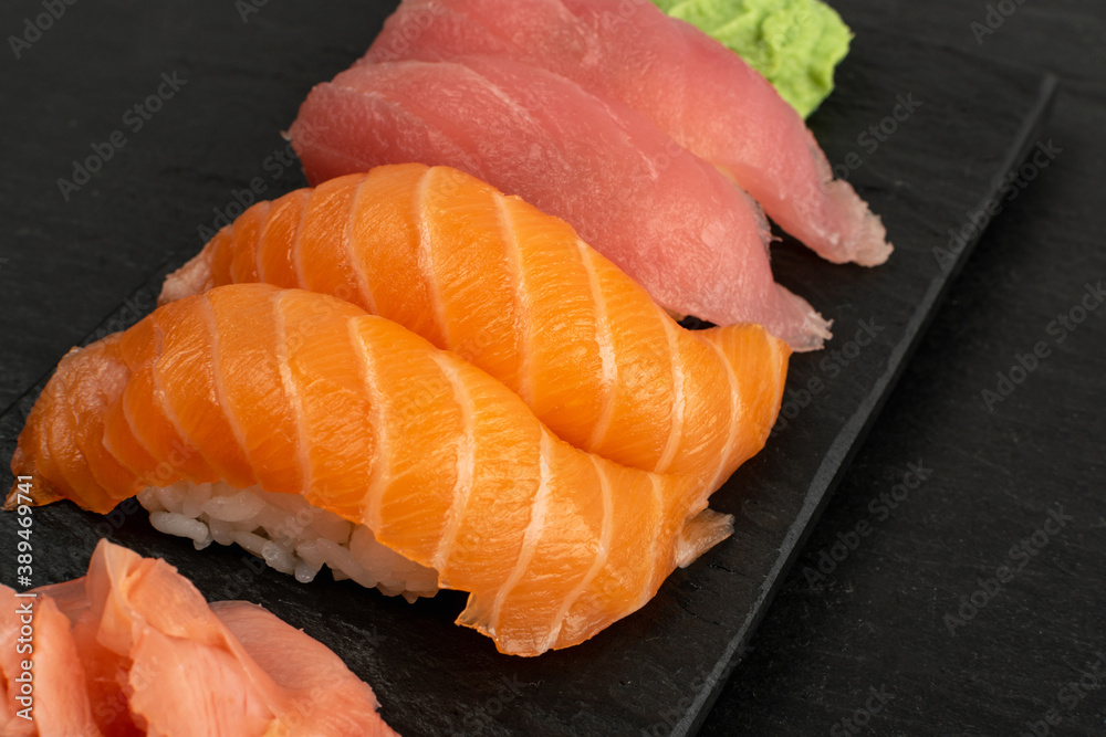 Macro photo of salmon nigiri sushi and maguro tuna Macro photo of salmon nigiri sushi and maguro tuna
