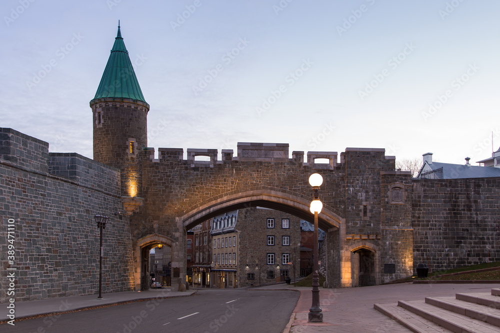 Fototapeta premium The historic St. John’s Gate, originally built in 1693 and rebuilt in 1940 seen during a Fall early morning, Quebec City, Quebec, Canada