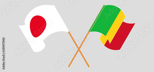 Crossed and waving flags of Mali and Japan