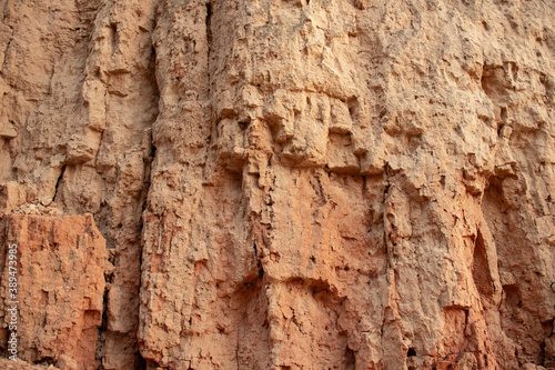 Texture of different layers of clay in clay cliff  photography. Background clay wall or clay cliff  photo