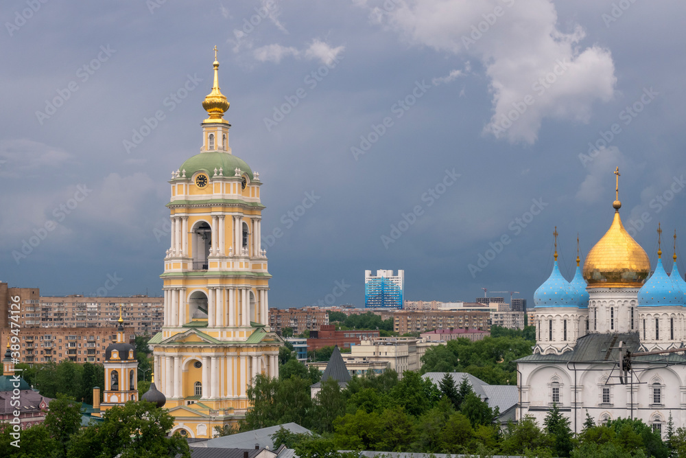 Moscow cityspace with Church and bell tower at Novospassky convent on cloudy day.