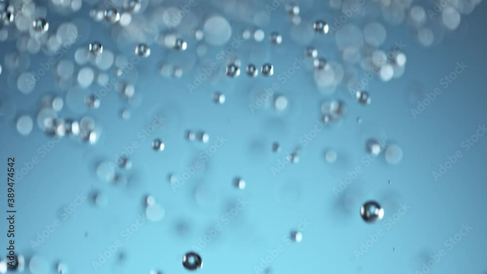 Super Slow Motion Shot of Falling Water Drops on Blue Background at 1000 fps. Super Slow Motion Shot of Falling Water Drops on Blue Background at 1000 fps.