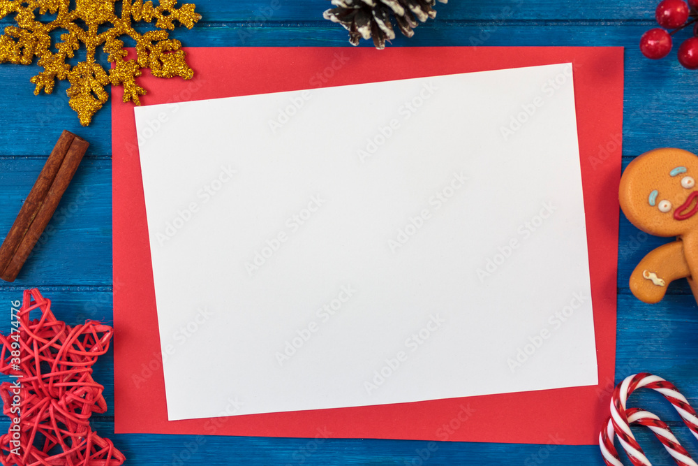 Φωτογραφία Top view of christmas decoration and blank card with copy space on blue wooden t