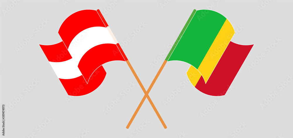 Crossed and waving flags of Mali and Austria Crossed and waving flags of Mali and Austria