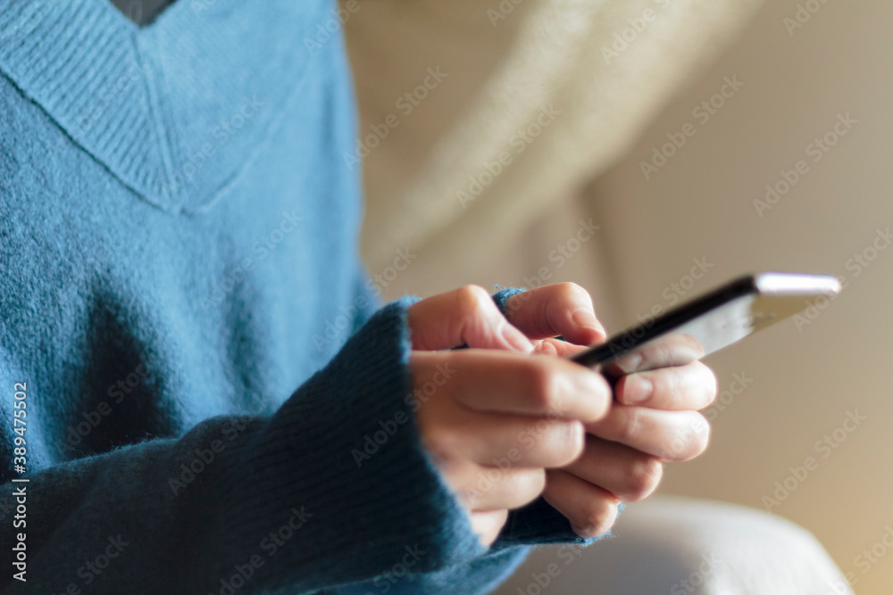 Woman hands using smartphone