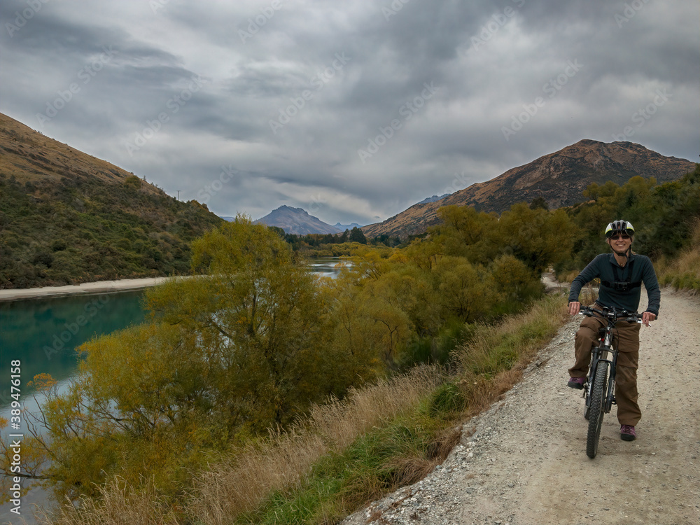 Biking on the Twin Rivers Trail toward the Shotover Bridge, Queenstown Area, South Island, New Zealand