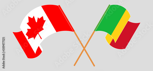 Crossed and waving flags of Mali and Canada