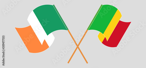 Crossed and waving flags of Mali and Ireland