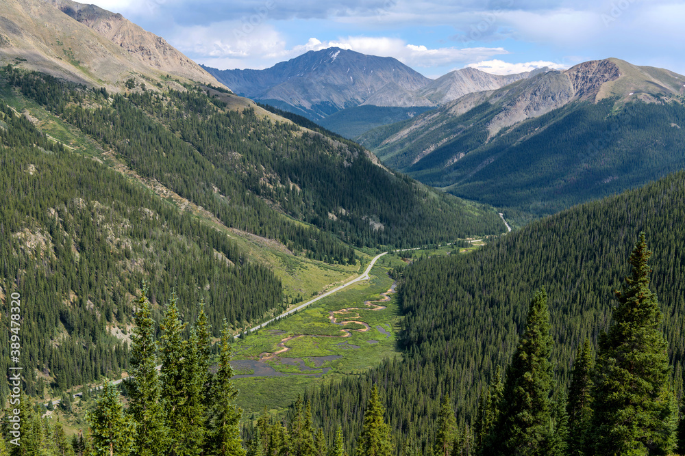 La Plata Peak - Summer view of Highway 82 winding in Lake Creek Valley at base of La Plata Peak (14,336 ft), part of Sawatch Range, seen from summit of Independence Pass (12,095 ft). Colorado, USA.