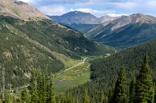La Plata Peak - Summer view of Highway 82 winding in Lake Creek Valley at base of La Plata Peak (14,336 ft), part of Sawatch Range, seen from summit of Independence Pass (12,095 ft). Colorado, USA. photo