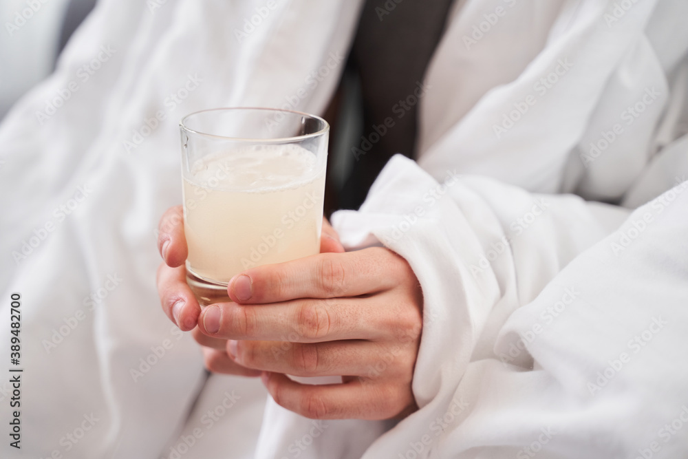 Man getting ready to drinking an effervescent tablet Man getting ready to drinking an effervescent tablet