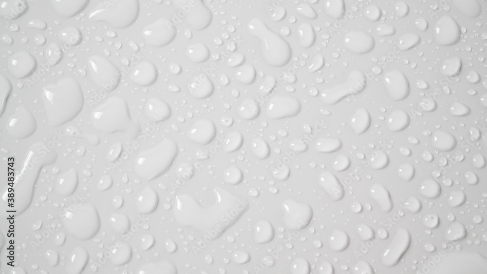 Clear waterdrops or water drops on a white ceramic surface background 