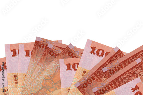 100 Sri Lankan rupees bills lies on bottom side of screen isolated on white background with copy space. Background banner template photo