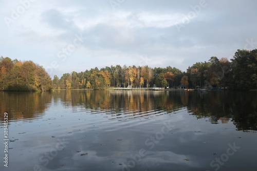Pier and holiday resort on the lake by the forest in beautiful autumn scenery. Lapino Lake, Kashubia, Poland