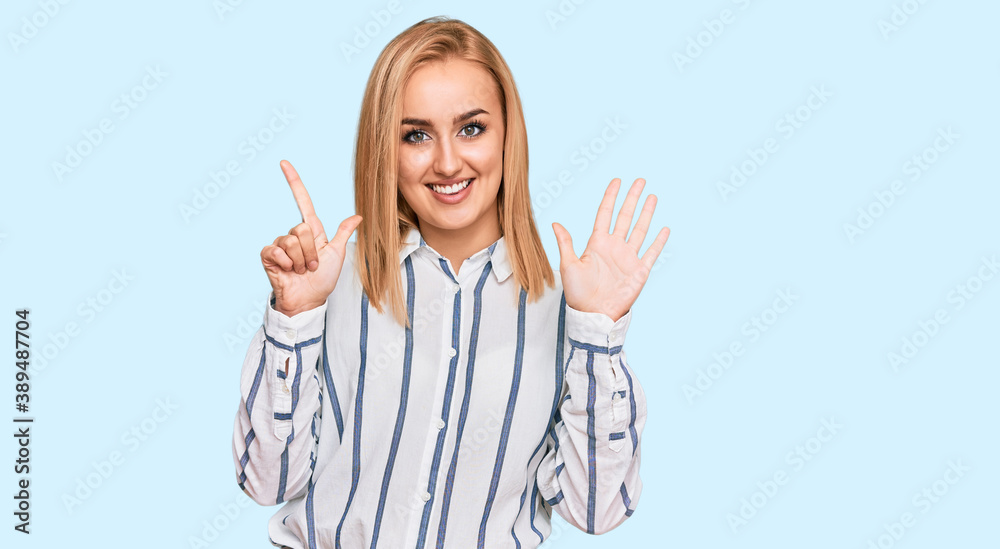 Beautiful caucasian woman wearing casual clothes showing and pointing up with fingers number seven while smiling confident and happy. Beautiful caucasian woman wearing casual clothes showing and pointing up with fingers number seven while smiling confident and happy.