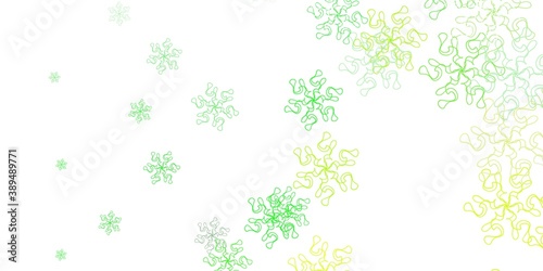 Light green  yellow vector doodle pattern with flowers.