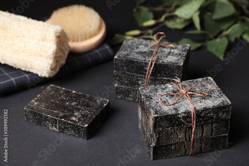 Fototapeta Naklejka Na Ścianę i Meble -  Natural tar soap on black table, closeup