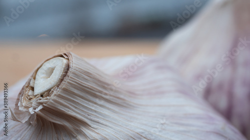 Photos Locally farmed fresh garlic on wooden cutting board with the archipelago as background