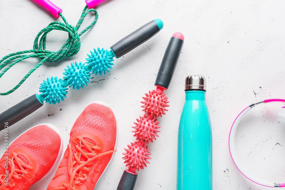Naklejka premium Sports equipment with body rollers on white background
