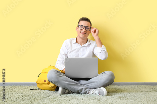Man with laptop studying on...