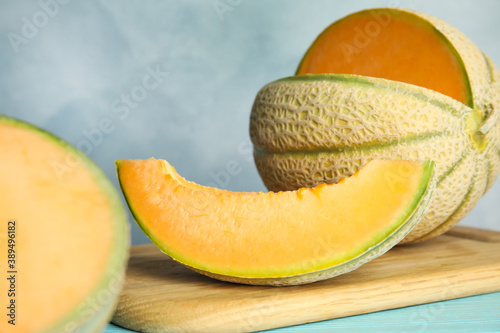 Tasty fresh melon on wooden board, closeup