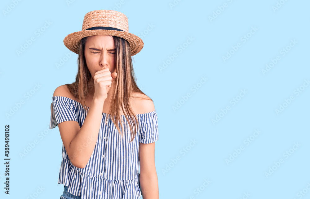 Young beautiful girl wearing hat and t shirt feeling unwell and coughing as symptom for cold or bronchitis. health care concept.