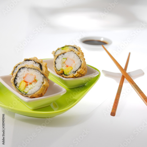Sushi - Tasty Japanese food made with raw fish and a variety of ingredients and seasonings.