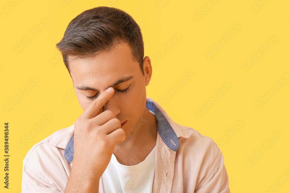 Stressed young man on color background Stressed young man on color background