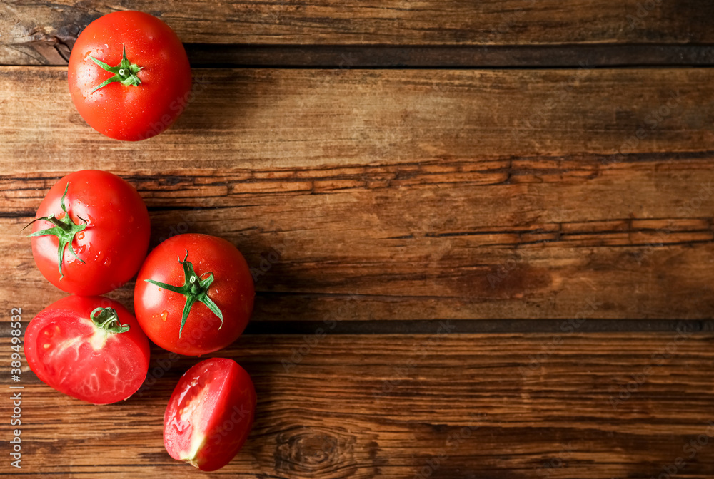 Fresh ripe tomatoes on wooden table, flat lay. Space for text Fresh ripe tomatoes on wooden table, flat lay. Space for text
