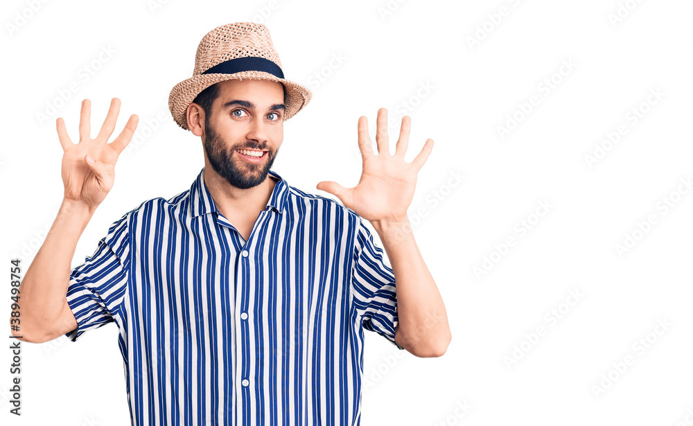 Young handsome man with beard wearing summer hat and striped shirt showing and pointing up with fingers number nine while smiling confident and happy. Young handsome man with beard wearing summer hat and striped shirt showing and pointing up with fingers number nine while smiling confident and happy.