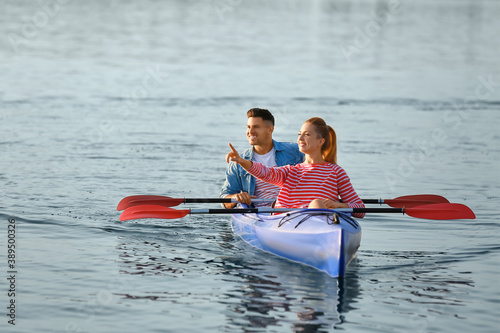 Young couple kayaking in river