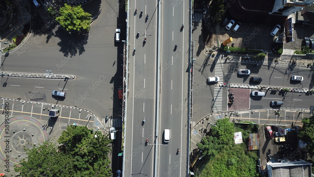 Aerial view of one of Bandung main city street: Dago Street, during the day, flyover view Aerial view of one of Bandung main city street: Dago Street, during the day, flyover view