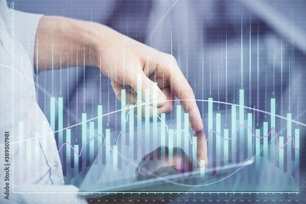 Double exposure of man's hands holding and using a digital device and forex graph drawing. Financial market concept. Double exposure of man's hands holding and using a digital device and forex graph drawing. Financial market concept.
