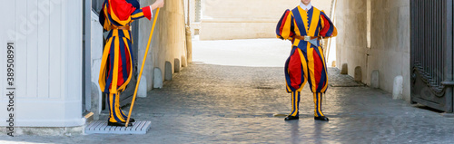 Papal swiss guard is guarding the vatican city in rome, italy photo