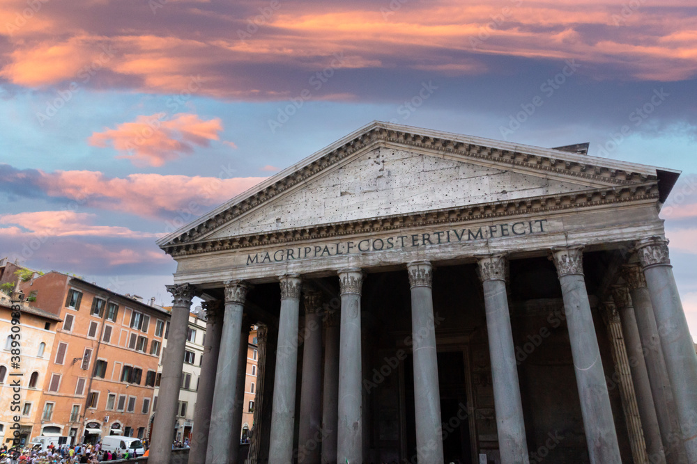 Pink skies and sunset over Pantheon roman temple and catholic church in rome Italy. Architecture and travelling concept.