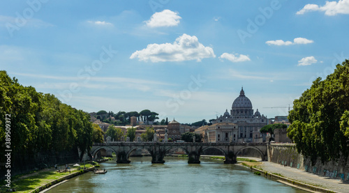 River tiber in rome italy with st peters basilica in the background during sunny day.