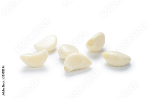 Peeled garlic isolated on white background