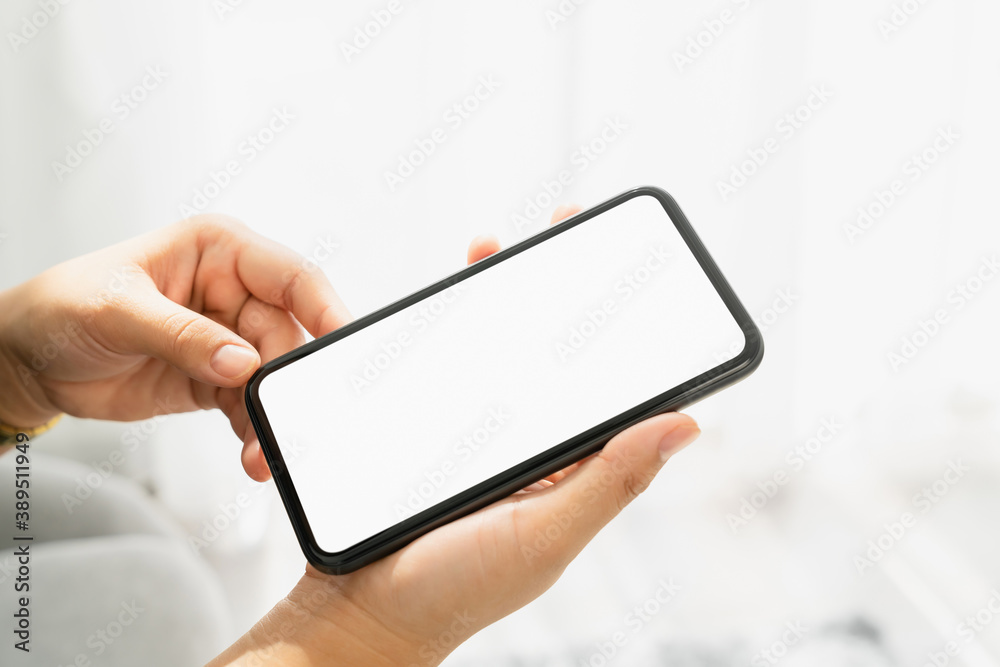 Woman hand holding smartphone and the screen is blank, social network concept, copy space for your advertising. Woman hand holding smartphone and the screen is blank, social network concept, copy space for your advertising.