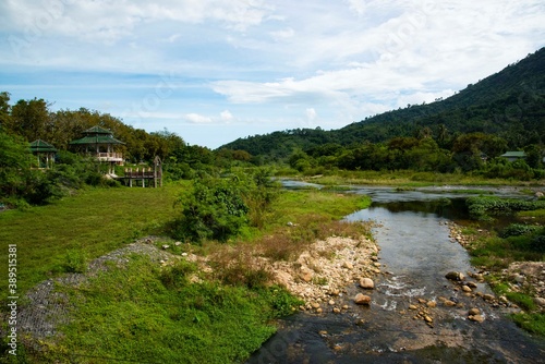 river and mountains with cloud and blue sky