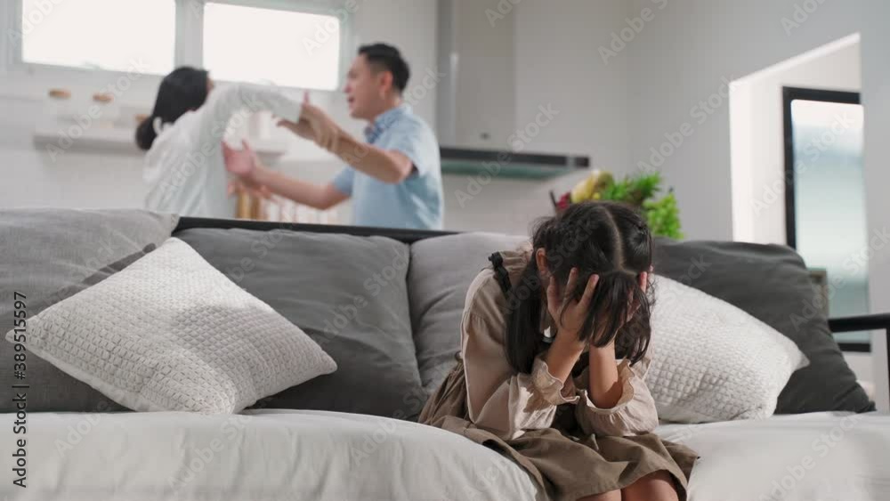 Asian young girl feeling sad to see family fighting, Domestic violence