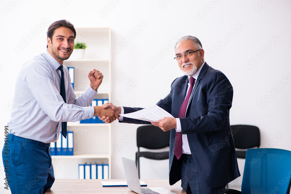 Young male candidate employee meeting with old recruiter Young male candidate employee meeting with old recruiter