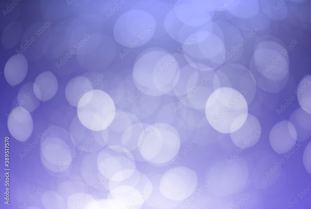 White bokeh defocus glitter blur on dark purple background. bokeh abstract background. White bokeh defocus glitter blur on dark purple background. bokeh abstract background.